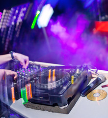 Dj mixing in night club