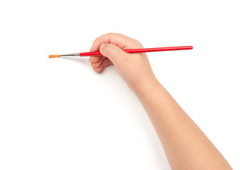 Naklejka premium paintbrush in child hand
