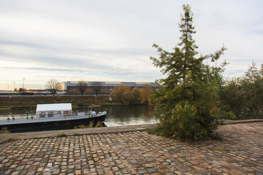 Fototapeta Boat on the river and a tree in France