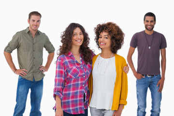 Obraz premium Fashionable young friends smiling at camera