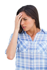 Woman with a headache and hand on forehead