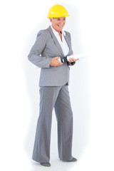 Cheerful architect with plan wearing hardhat