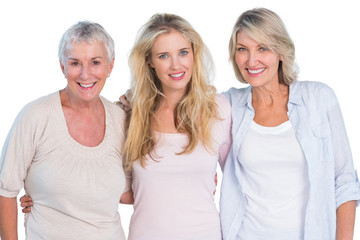 Three generations of  happy women smiling at camera