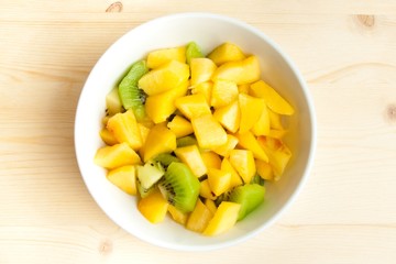 diet, healthy fruit salad in the white bowl - healthy breakfast