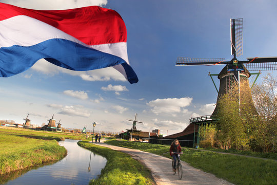 Windmills with flag of Holland in Zaanse Schans
