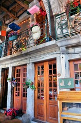 Balcony of a restaurant in Porto decorated with old objects