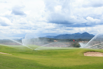 sprinklers on golf course