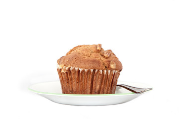 Isolated nut muffin in a plate