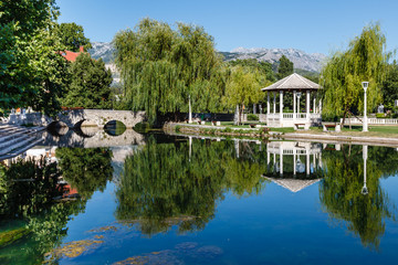 Obraz premium Picturesque Landscape, Stone Bridge, Pavilion, River and Willow,