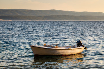 Lonely Boat and Island Brac at Sunset, Dalmatia, Croatia