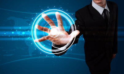 Businessman pressing high tech type of modern buttons