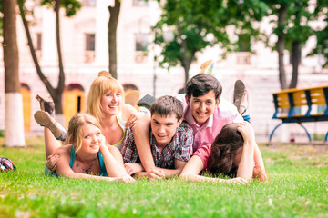 Group of happy smiling Teenage Students Outside