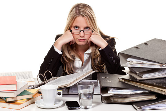 stressed woman in front of a desk