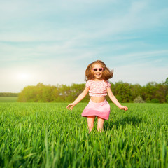 Fototapeta premium little girl on the field
