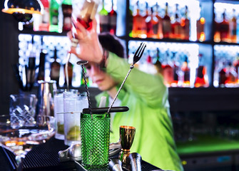 Barman professional making cocktail