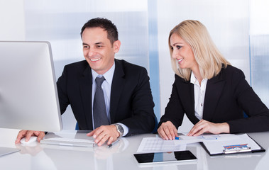 Two Happy Business Colleagues At Office