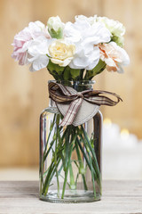 Bouquet of carnation flowers in glass vase