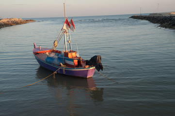 Fototapeta premium fisherman boat at sunrise time