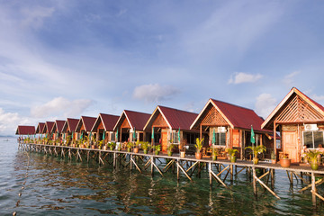 Obraz premium Over water bungalow with bule sky