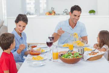 Obraz na płótnie Canvas Family dining together