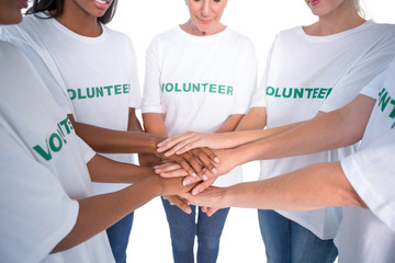 Group of female volunteers with hands together