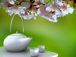 Teapot and cups on table