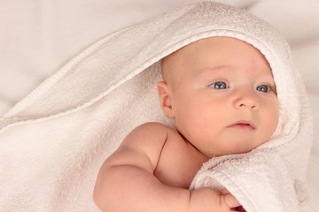 baby in white towel