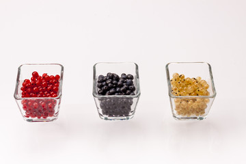 Blue berry, red and white currant - white background.