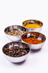 Curry, pepper,  paprika and coriander - white background.