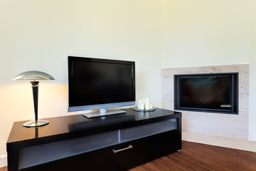 Bright space - television set and fireplace