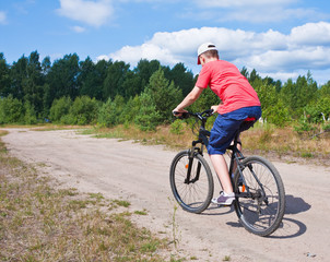 Fototapeta premium mountain bike teenager with blue sky