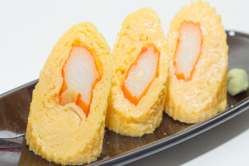 Fried egg roll on dish.