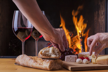delicious cheese and wine at the fireplace