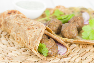 Kati Roll - Kofta and red onion in a paratha fried with eggs