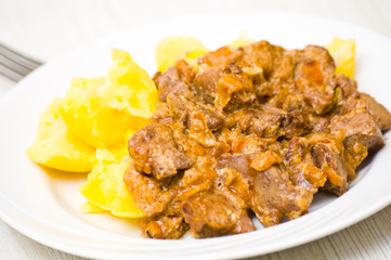 chicken livers in a creamy sauce with potato