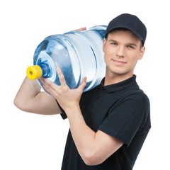 Water delivery. Cheerful young deliveryman holding a water jug w