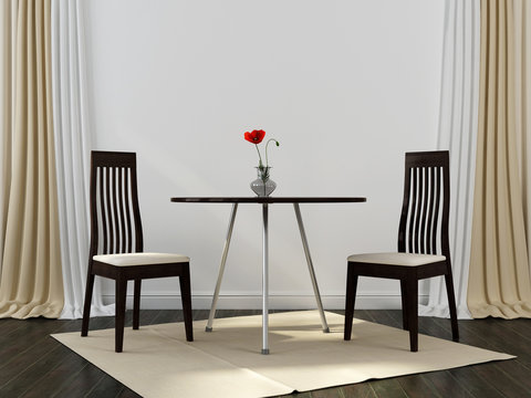 Two black chairs and a table