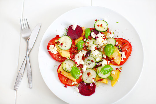 Beetroot salad with mango, tomatoes and feta cheese