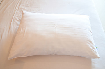 White Pillow On a Bed