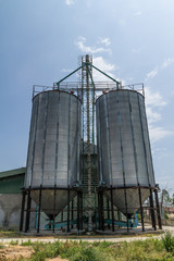 Two metal silo