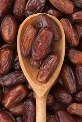 Wooden spoon with dried dates