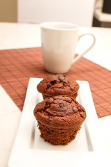 Chocolate Muffins with a cup of coffee
