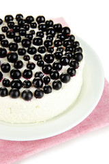 Cheesecake with fresh berries on white plate closeup