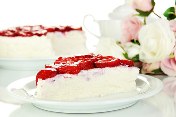 Cheesecake with fresh strawberry on white plate closeup