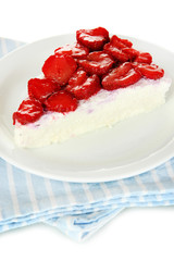 Cheesecake with fresh berries on white plate closeup