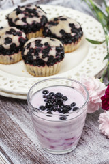 Blueberry smoothie on wooden rustic tray. Summer party