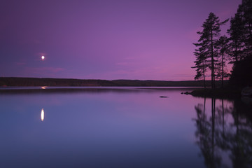 Moonlight over a Swedish lake, the moon are reflecting