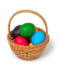 Easter eggs in basket over white