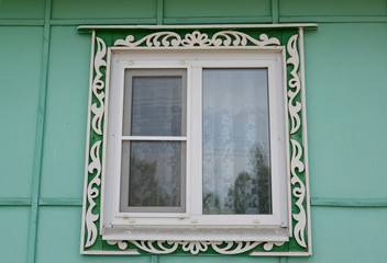 Fototapeta premium Window with carved platbands