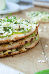stack of slices of pizza with zucchini